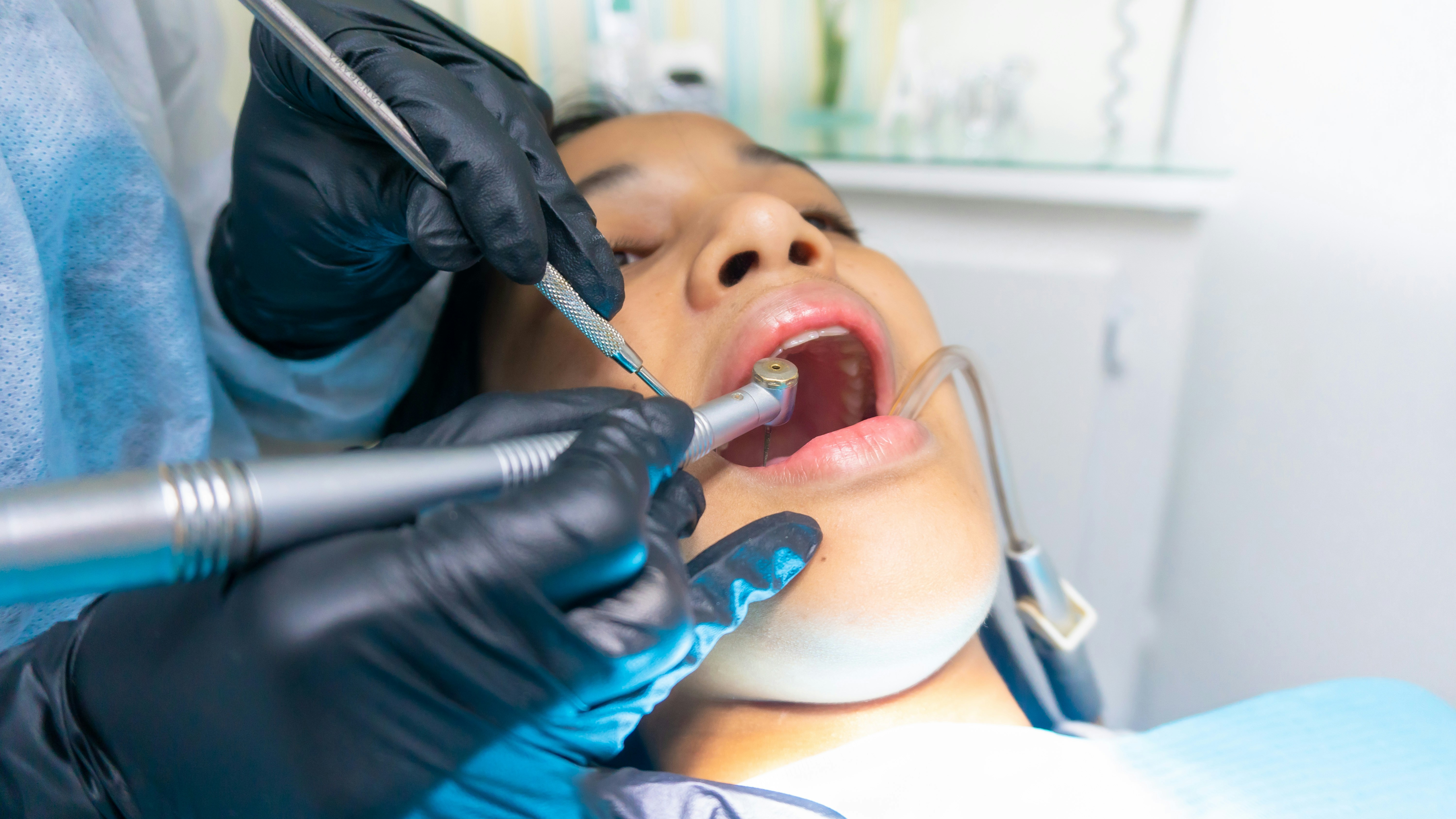 Dental professional reviewing a patient's x-ray